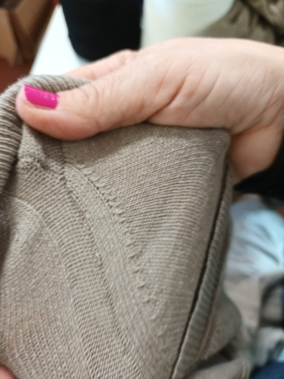 Close-up of knitwear linking and garment construction